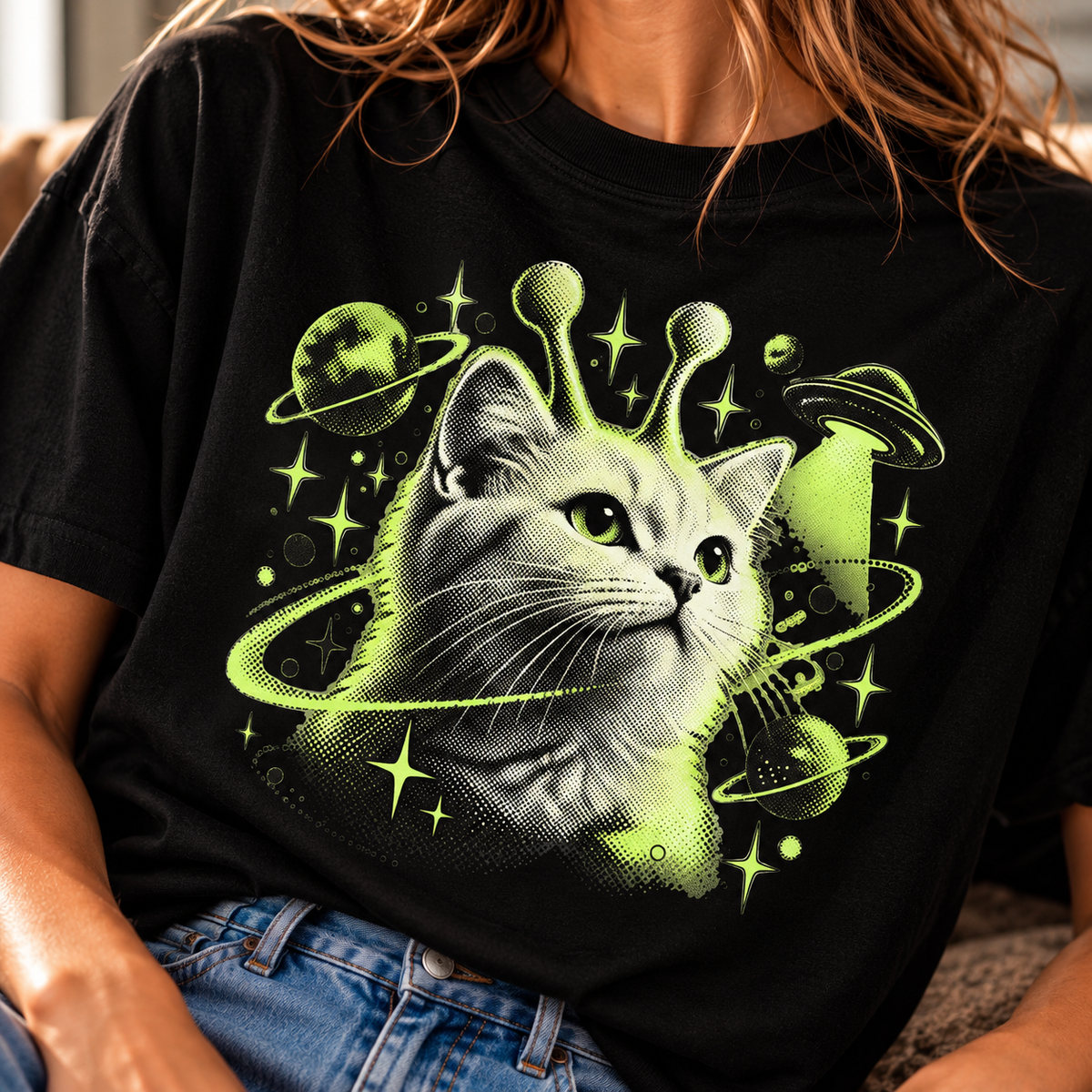 Black cosmic cat graphic T-shirt with bright green space-themed artwork